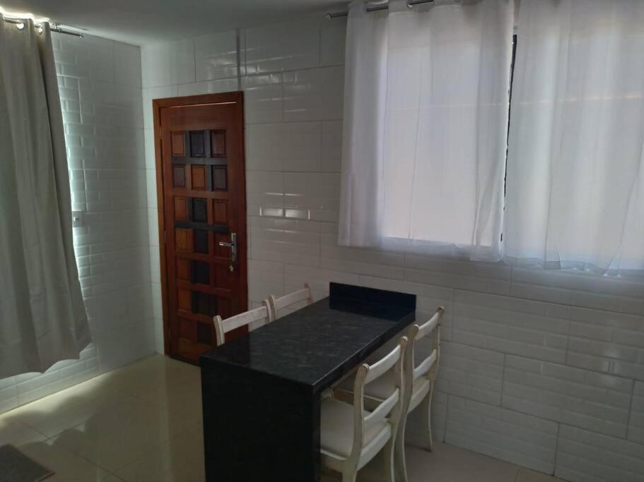 Casa agradável em Camboriú com estacionamento no pátio Vila Exterior foto